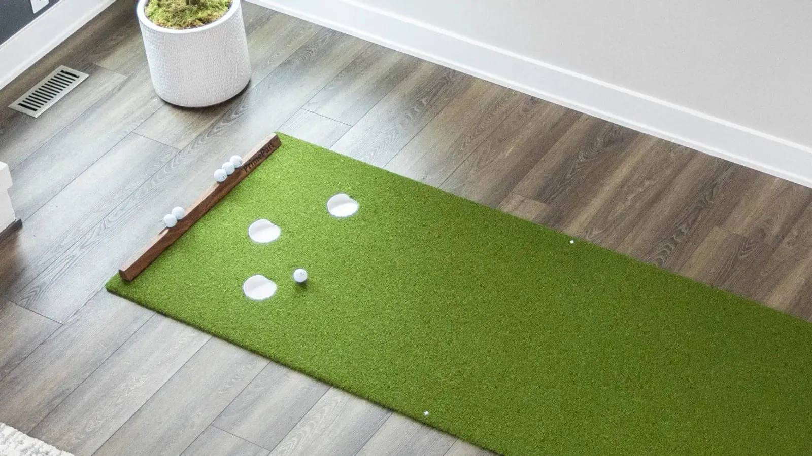 PrimePutt indoor putting mat on a hardwood floor