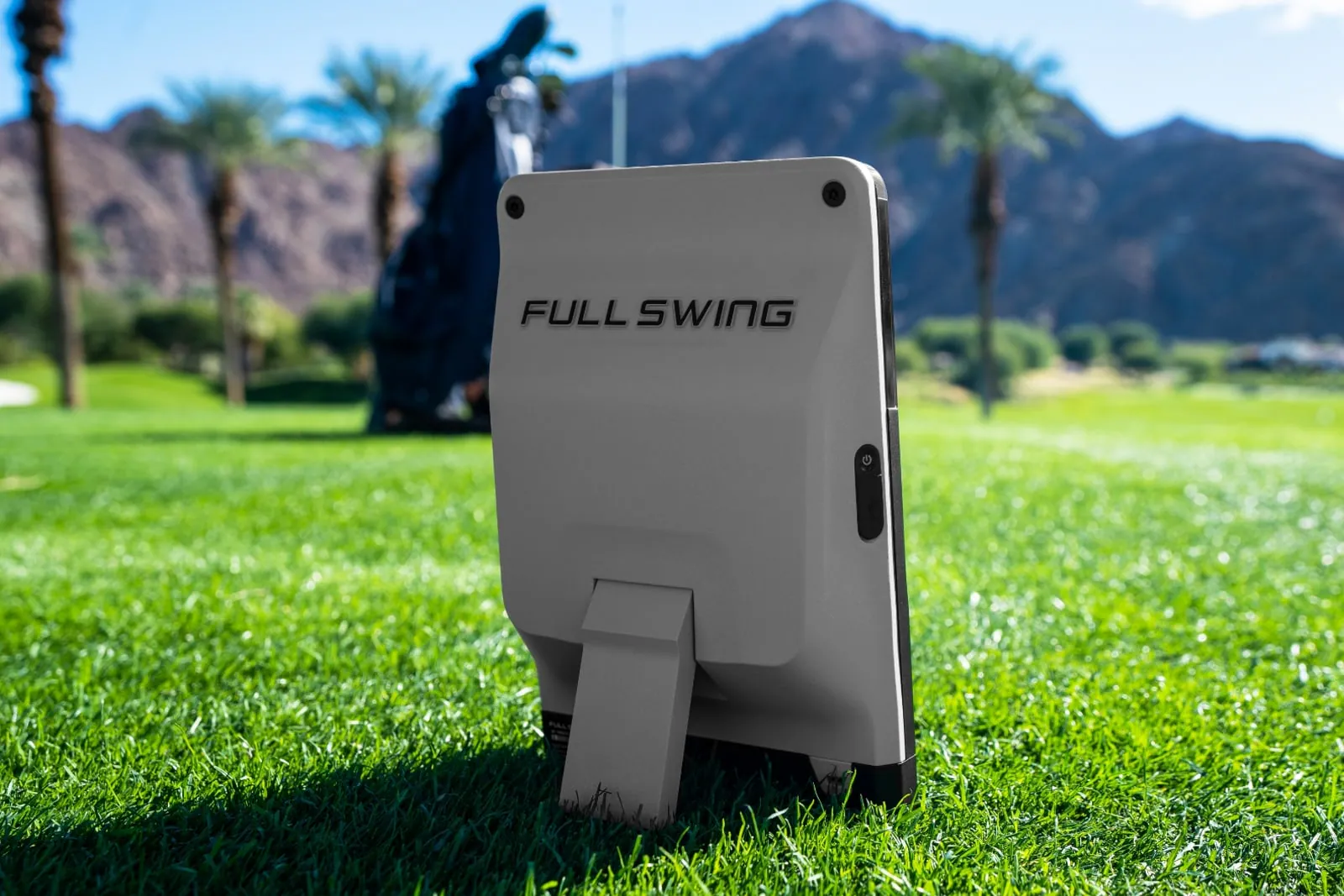 Full Swing KIT launch monitor on the grass