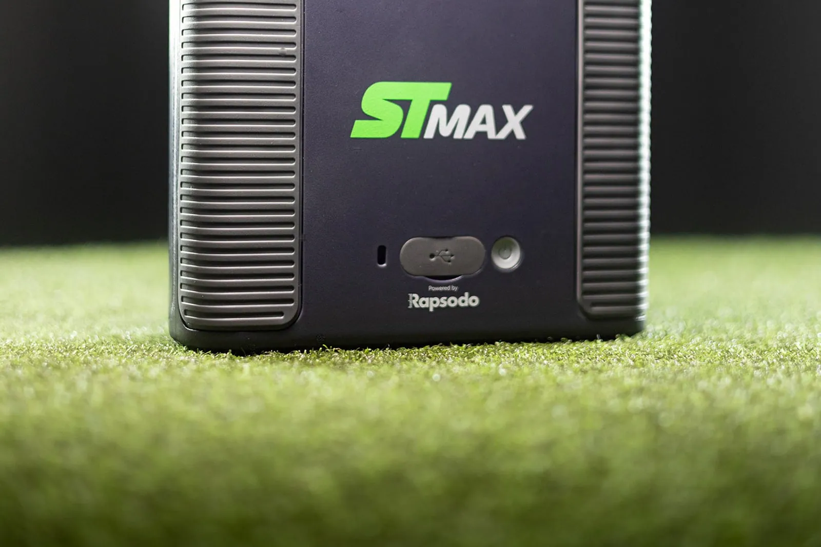 SkyTrak ST MAX launch monitor sitting on turf